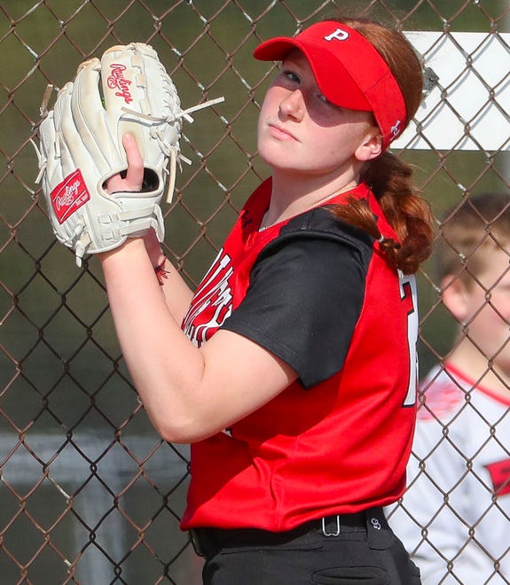 Polytech's Gabrielle Bogdon checks the runner after making catch in foul territory in the third inning of Polytech's 8-3 win at Smyrna High School, Thursday, April 18, 2024.