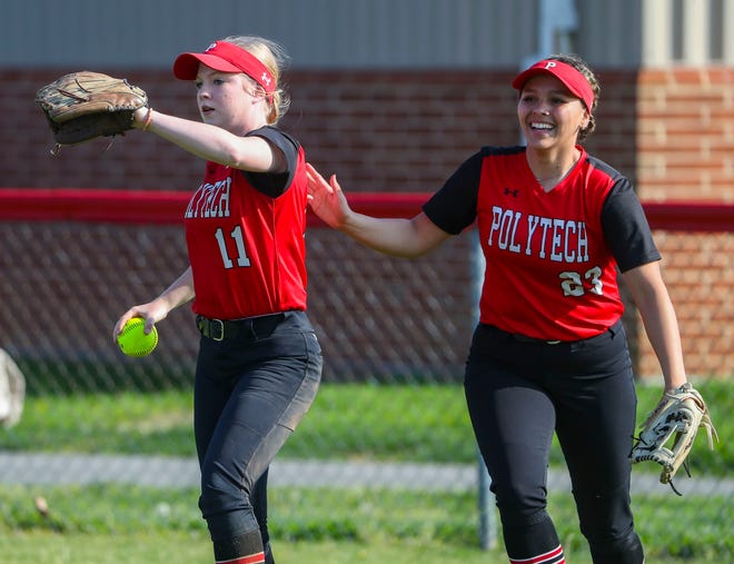Polytech's Cheyenne Silves (left) gets congratulated by right fielder Kyla Davis after Silves ended the third inning with a running catch in Polytech's 8-3 win at Smyrna High School, Thursday, April 18, 2024.