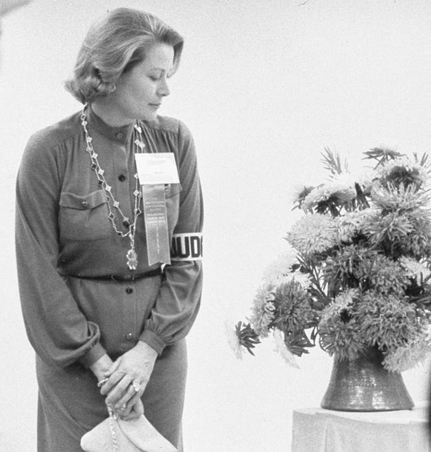 Princess Grace judges an exhibit at the Philadelphia Flower show in 1976.