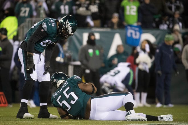 Eagles' Brandon Graham (55) goes down with an injury during the first half against the Seahawks Sunday at Lincoln Financial Field.