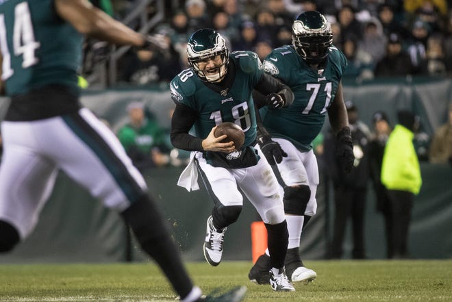 Eagles' Josh McCown (18) scrambles for a few yards Sunday night at Lincoln Financial Field. The Seahawks defeated the Eagles ending their season 17-9.