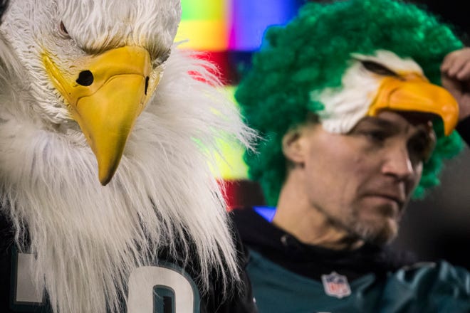 Eagles fans hang their heads during Philadelphia's 17-9 loss to the Seattle Seahawks Sunday night at Lincoln Financial Field.