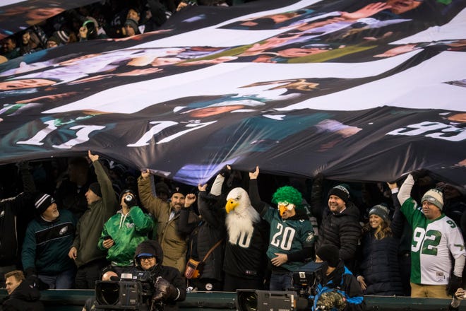 Eagles fans celebrate the kickoff of their NFC Wild Card matchup against the Seattle Seahawks Sunday night at Lincoln Financial Field. The Seahawks defeated the Eagles ending their season 17-9.