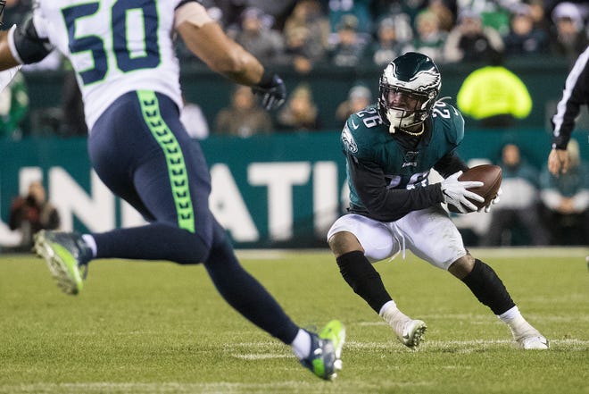 Eagles' Miles Sanders (26) makes a cut back towards the Seattle defense Sunday night at Lincoln Financial Field. The Seahawks defeated the Eagles ending their season 17-9.