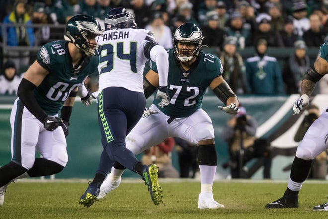 Eagles' Halapoulivaati Vaitai (72) looks for a block Sunday night at Lincoln Financial Field. The Seahawks defeated the Eagles ending their season 17-9.