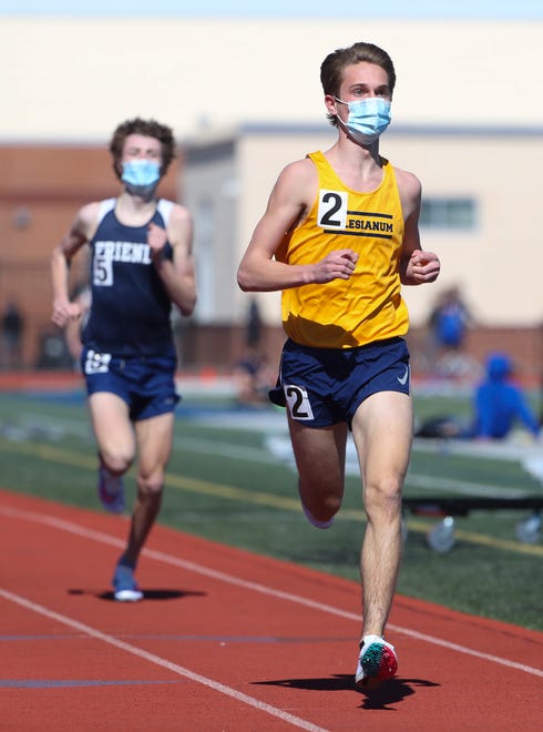 Salesianum's Ryan Banko finishes first in the 1600 meter run ahead of Wilmington Friends' Max Leffler during the DIAA state indoor track and field championships at Dover High School Wednesday, March 3, 2021.