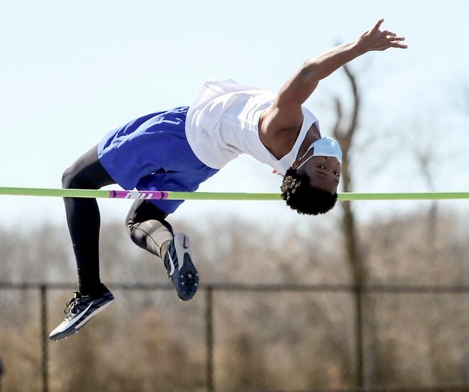 Dover's Mishandray Etienne clears one of his attempts on the way to winning the high jump during the DIAA state indoor track and field championships at Dover High School Wednesday, March 3, 2021.