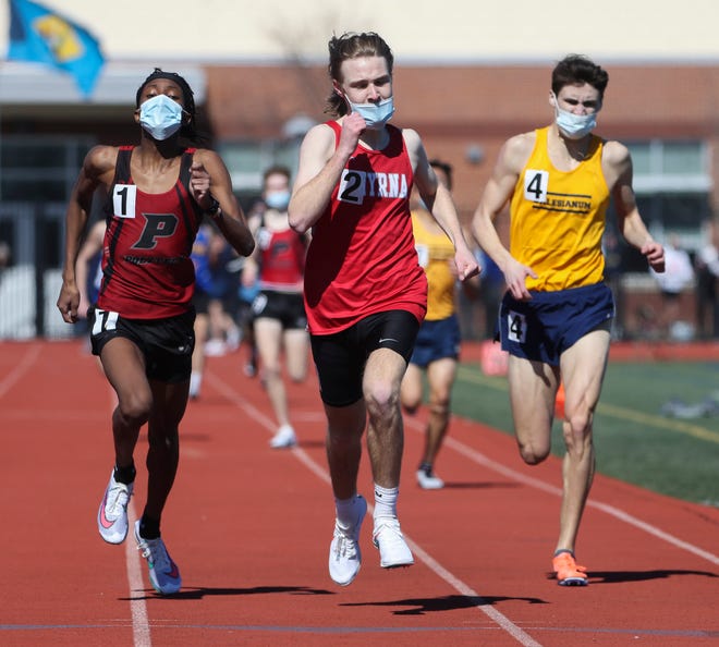 Smyrna's Liam Meginniss (center) keeps ahead of Polytech's Matt Gatune (left) and Salesianum's Luke Riley as Meginniss wins the 800 meter run during the DIAA state indoor track and field championships at Dover High School Wednesday, March 3, 2021.